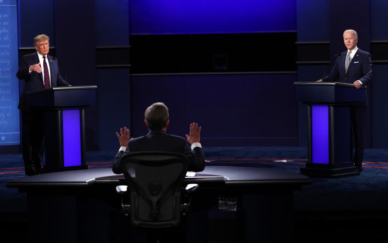 President Donald Trump, left, and Democratic presidential nominee Joe Biden, right, participate in the first presidential debate, moderated by Fox News anchor Chris Wallace at the Health Education Campus of Case Western Reserve University, on Tuesday in Cleveland. (SCOTT OLSON/Getty Images)