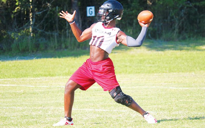 Fort White quarterback Tyler Jefferson throws during practice last season. The Indians will hold their first fall practice on Tuesday. (FILE)