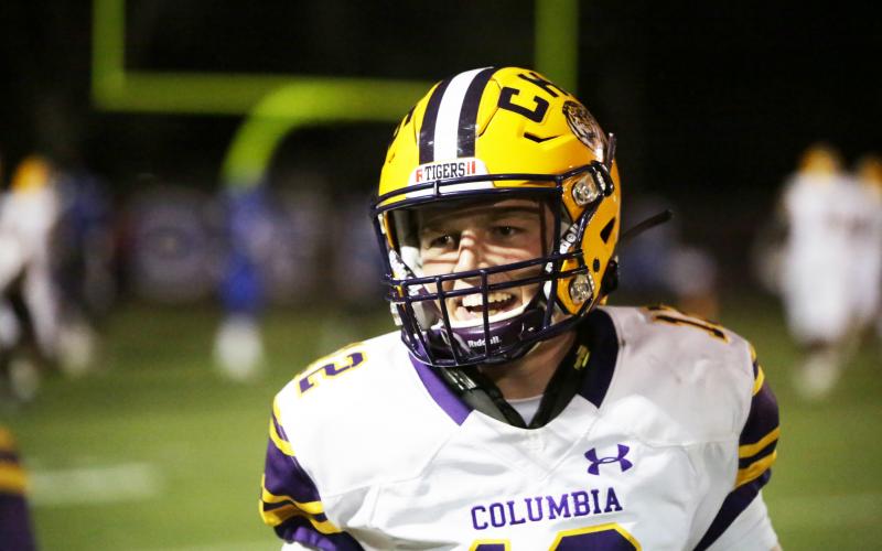 Columbia quarterback Ty Wehinger smiles coming off the field after throwing a touchdown pass last week against Trinity Christian. (BRENT KUYKENDALL/Lake City Reporter)