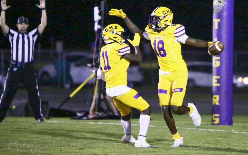 Columbia receiver Marcus Peterson  (18) celebrates with receiver Jaquez Redic (11) after scoring a touchdown against Florida High last Friday. (BRENT KUYKENDALL/Lake City Reporter)