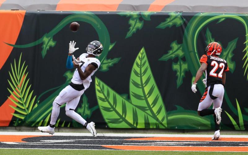 Jacksonville Jaguars wide receiver D.J. Chark (17) makes a catch for a touchdown in front of Cincinnati Bengals cornerback William Jackson (22) on Oct. 4 in Cincinnati. (AARON DOSTER/Associated Press)