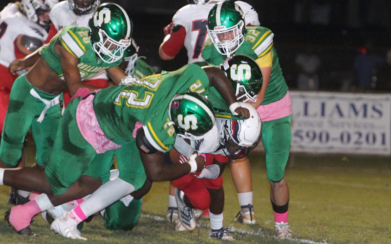 Suwannee’s defense converges for a tackle against Wakulla on Friday night. (PAUL BUCHANAN/Special to the Reporter)
