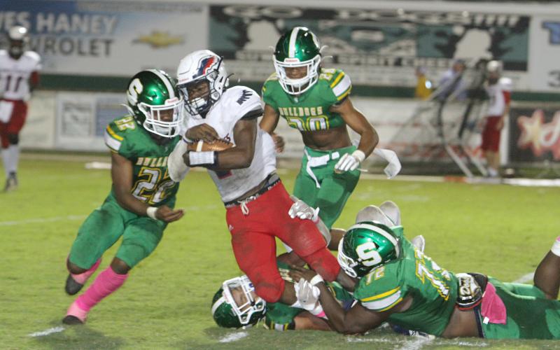 Suwannees defense converges for a tackle against Wakulla last Friday. (PAUL BUCHANAN/Special to the Reporter)