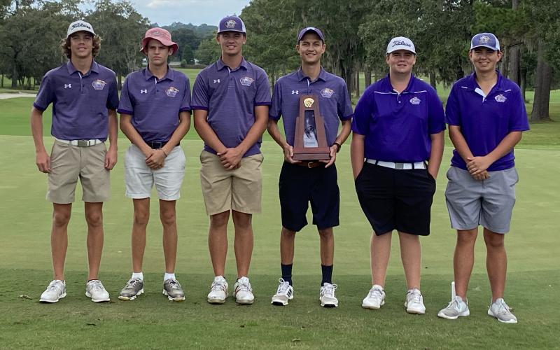 Columbia’s boys golf team won its second straight District 2-2A title on Monday. Pictured with the trophy are Zach Shaw (from left), Spencer McCranie, Ty Folsom, coach Chase Hagler, Connor Williams and Josef Walker. (COURTESY)