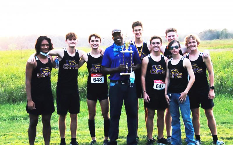 Columbia’s cross country team is pictured with coach Lawrence Davis after winning the Tiger Run at Alligator Lake on Thursday. (SHELBY CONKLIN/Special to the Reporter)