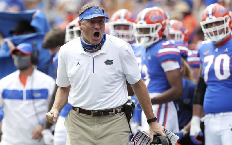Florida head coach Dan Mullen yells to a referee about a missed call during Saturday’s game against South Carolina, in Gainesville. (BRAD MCCLENNY/AP Pool Photo)