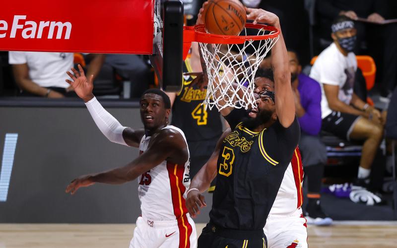 Los Angeles Lakers forward Anthony Davis (3) dunks during the first half against the Miami Heat in Game 2 of the NBA Finals on Friday at AdventHealth Arena at ESPN Wide World Of Sports Complex in Lake Buena Vista, Florida. The Lakers won, 124-114, for a 2-0 series lead. (KEVIN C. COX/Getty Images/TNS)