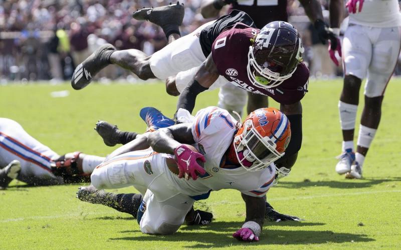 Florida wide receiver Kadarius Toney (1) is stopped just short of the goal line by Texas A&M defensive back Myles Jones (0) during the second quarter on Saturday in College Station, Texas. (SAM CRAFT/Associated Press)