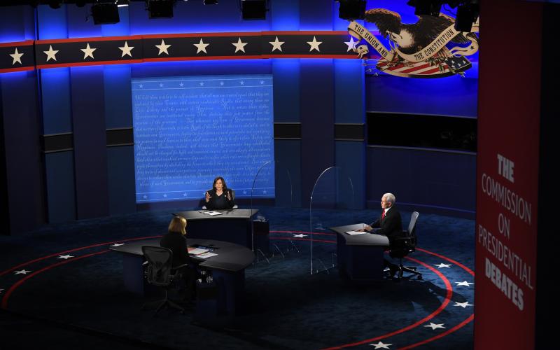 The candidates debate on stage during the Vice Presidential debate between Republican nominee Vice President Mike Pence and Democratic nominee Sen. Kamala Harris held at Kingsbury Hall at The University of Utah. Susan Page, Washington Bureau Chief for USA Today, is the moderator. (JACK GRUBER/USA Today Pool Photo)
