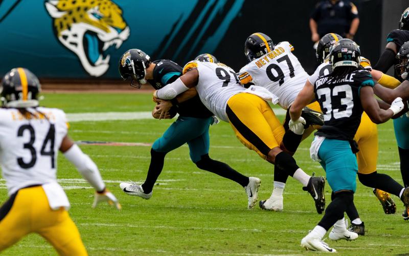 Jacksonville Jaguars quarterback Jake Luton (6) is sacked by Pittsburgh Steelers defensive end Stephon Tuitt (91) during Sunday's game at TIAA Bank Field in Jacksonville. (MATT PENDLETON/TNS)