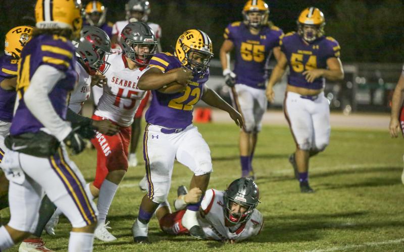 Columbia running back Tony Fulton escapes a tackle against Seabreeze during Friday’s Region 1-6A quarterfinal. (BRENT KUYKENDALL/Lake City Reporter)