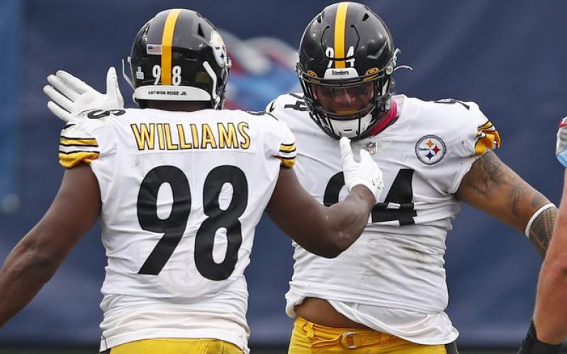 Pittsburgh Steelers inside linebacker Vince Williams (98) celebrates with nose tackle Tyson Alualu (94) after Williams sacked Tennessee Titans quarterback Ryan Tannehill (17) on Oct. 25 in Nashville, Tenn. (WADE PAYNE/Associated Press)