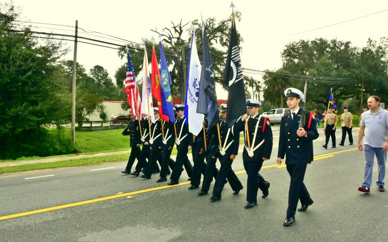 Members of the Suwannee High NJROTC present the colors during Wednesday’s Veterans Day parade through Live Oak. (ROB WOLFE/Special to the Reporter)