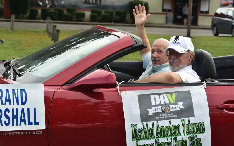 Live Oak Police Chief Keith Davis waves during the Veterans Day parade Wednesday. Davis was the grand marshal of the parade. (ROB WOLFE/Special to the Reporter)
