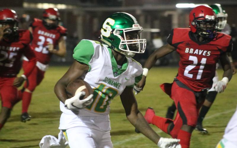 Suwannee’s Jay Smith returns a kickoff against Terry Parker during Friday’s Region 1-5A playoff game. (JAMIE WACHTER/Lake City Reporter)