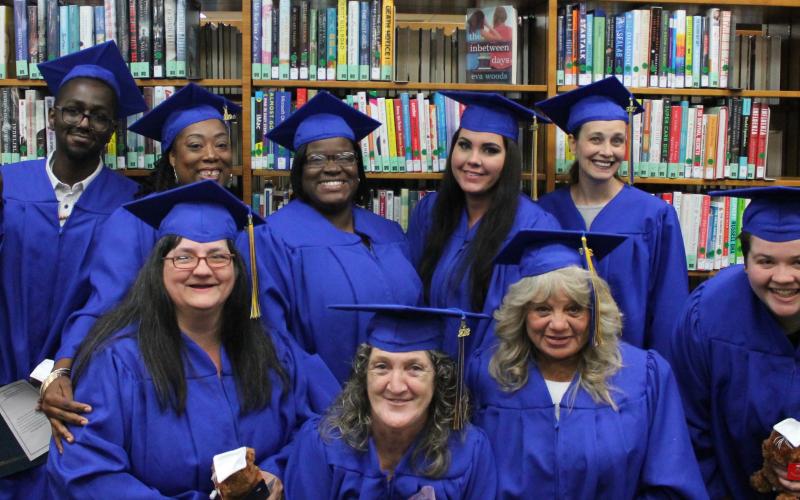 Graduating with their diploma in 2019 through the library’s program were Carrie Murphy (front row, from left), Kitty Dawson, Edith Daniel-Crown, Sheldon Taylor; and Darius Turner (back row, from left), Antrice Byrd, Melissa Perry, Jessica Blake and Deanna Bosket. (COURTESY)