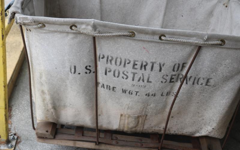Old small buggies that hadn’t been used by the United States Postal Service for several decades, according to Live Oak Postmaster Blair Beatty, had still played a vital role at the Live Oak Post Office due to its cramped quarters. (JAMIE WACHTER/Lake City Reporter)