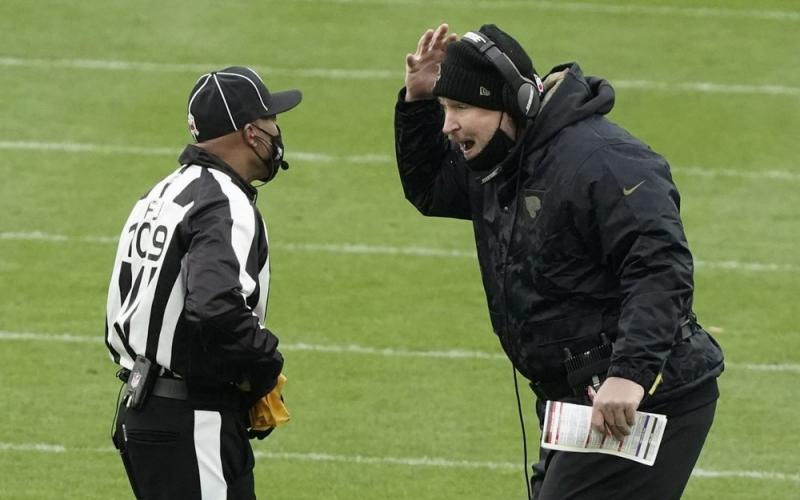 Jacksonville Jaguars head coach Doug Marrone argues a call with side judge Dyrol Prioleau (109) during the second half of Sunday's game against the Green Bay Packers on Sunday in Green Bay, Wis. The Packers won 24-20. (MARRY GASH/Associated Press)