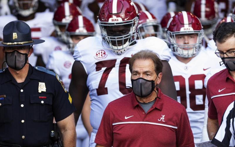 Alabama coach Nick Saban leads his team to the field before a against Missouri on Sept. 26 in Columbia, Mo. Alabama is No. 1 in The Associated Press college football poll for the first time this year, extending its record of consecutive seasons with at least one week on top of the rankings to 13. (AP FILE PHOTO)