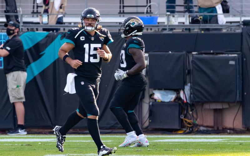 Jacksonville Jaguars quarterback Gardner Minshew (15) runs off the field after throwing a touchdown against the Tennessee Titans at TIAA Bank Field on Sunday in Jacksonville. (MATT PENDLETON/TNS)