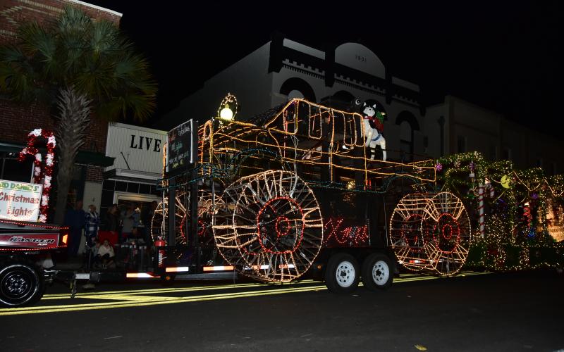 Ward’s Famous Lights’ float lit up Live Oak as it took part in the lighted Christmas parade to end Christmas on the Square on Saturday night. (RON WOLFE/Special to the Reporter)
