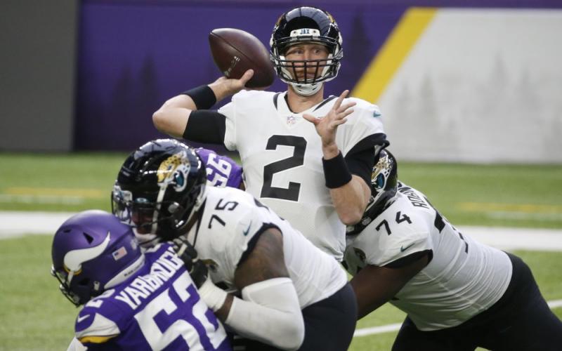 Jacksonville Jaguars quarterback Mike Glennon throws a pass against the Minnesota Vikings on Dec. 6 in Minneapolis. (BRUCE KLUCKHOHN/Associated Press)