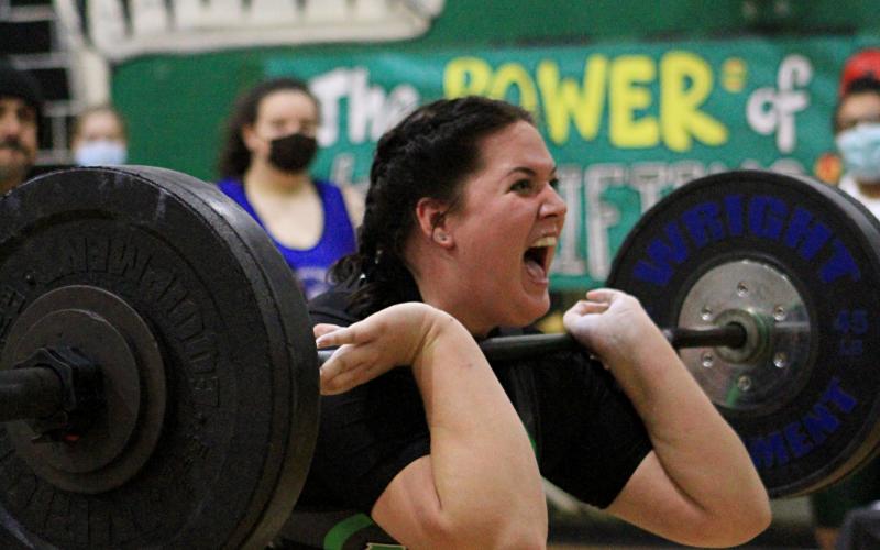 Suwannee’s Samantha Barber pumps herself up during a lift Friday at the Power of Christmas Invitational at SHS. Barber finished fourth in the unlimited division. (PAUL BUCHANAN/Special to the Reporter)