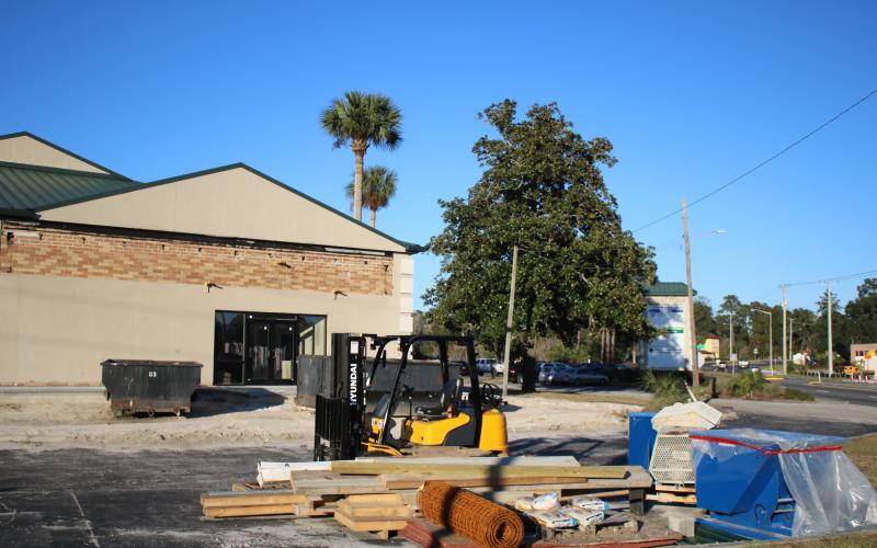 Construction equipment and supplies sit adjacent next to the Duval Place Professional Office plaza Friday, where a portion of  the building is being renovated to house the county’s Tourist Development Council and Economic Development offices. (TONY BRITT/Lake City Reporter)