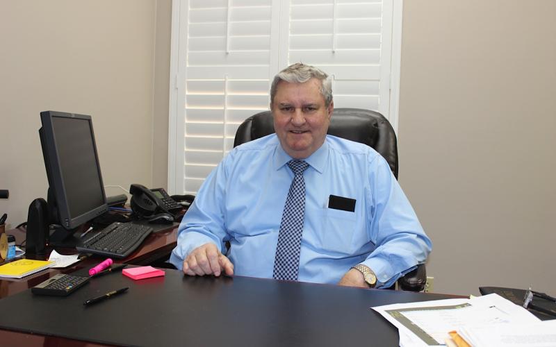 Longtime Lake City banker Gil Miller will retire from Drummond Community Bank this week after 43 years in banking and 57 years overall working in finance. He has worked for several area banks as a lending officer during his career. (TODD WILSON/Lake City Reporter)