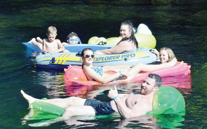 The Scott family floats down the Ichetucknee River in this file photo from the 2016 summer tubing season. Tubing may no longer be allowed on the Upper Ichetucknee according to a plan proposed by the Florida Department of Environmental Protection. (FILE)