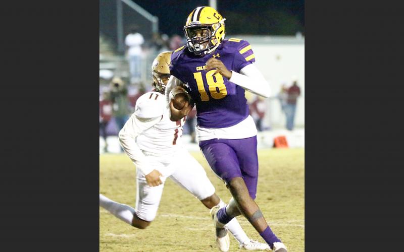 Columbia’s Marcus Peterson scrambles up the field  against St. Augustine during Friday’s Region 1-6A final. (JEN CHASTEEN/Special to the Reporter)