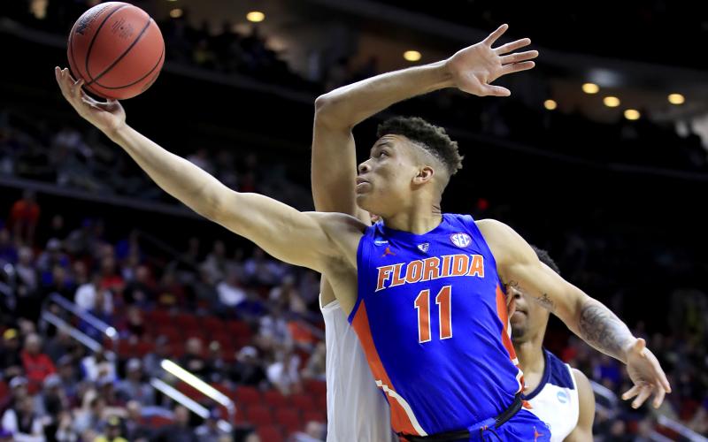 Florida forward Keyontae Johnson, seen here in a 2019 game, was hospitalized in critical but stable condition after collapsing on court during Saturday’s game against Florida State. (ANDY LYONS/Getty Images/TNS)