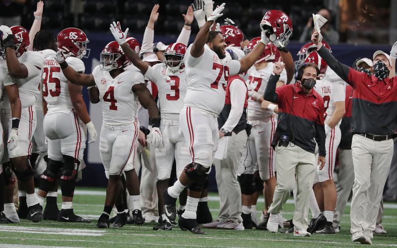Nick Saban and Alabama players react after running back Najee Harris scored a touchdown against Florida during the fourth quarter of the SEC Championship game Saturday. (Curtis Compton/Atlanta Journal-Constitution/TNS)