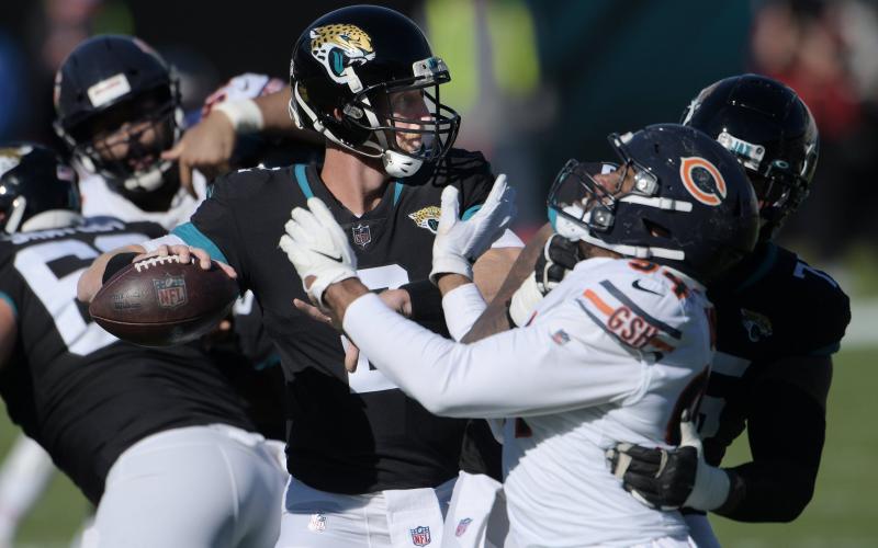 Jaguars quarterback Mike Glennon (2) looks for a target while under pressure during second quarter action against the Chicago Bears on Dec. 27 in Jacksonville. (BOB SELF/TNS)