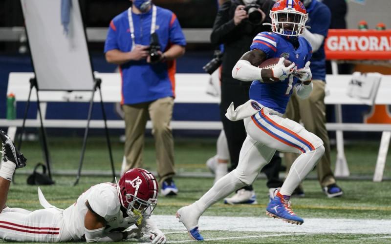 Florida wide receiver Kadarius Toney (1) runs for a touchdown after a catch during the first half of the Southeastern Conference championship game against Alabama on Dec. 19 in Atlanta. (JOHN BAZEMORE/Associated Press)