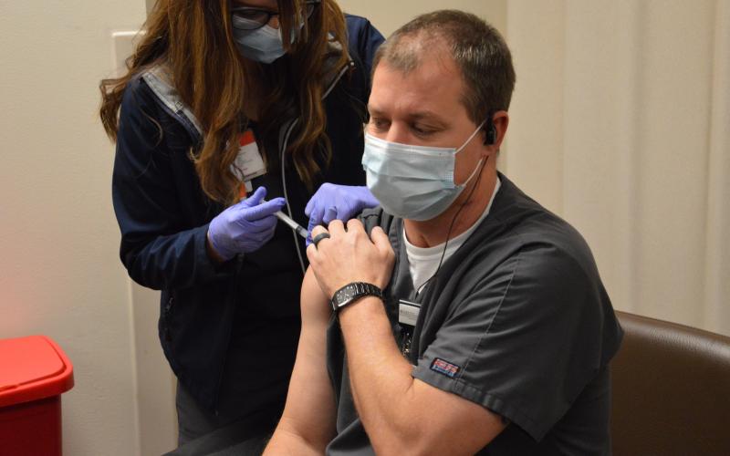 Brian Sellers was the first employee at Lake City Medical Center to receive the covid-19 vaccine on Monday. Sellers works in the emergency room at the hospital, which started vaccinating employees Monday with the Moderna vaccine. (COURTESY)