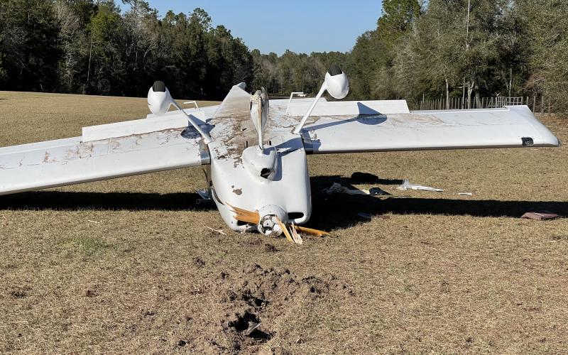 A small airplane flipped over on a grass airstrip in O’Brien on Friday afternoon after its front wheel broke after landing. (COURTESY SUWANNEE COUNTY SHERIFF'S OFFICE)