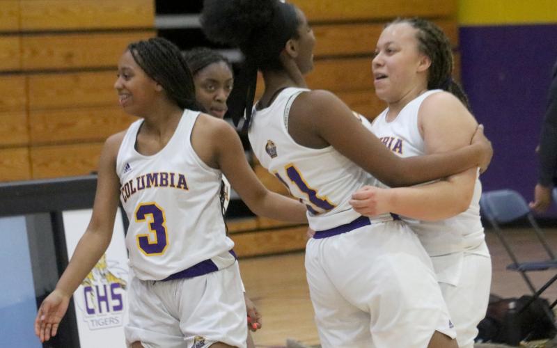 Columbia forwards Zimora Owens (left) and Amaiya Callum (right) celebrate after Callum’as game-winner  against Buchholz on Tuesday night. (JORDAN KROEGER/Lake City Reporter)