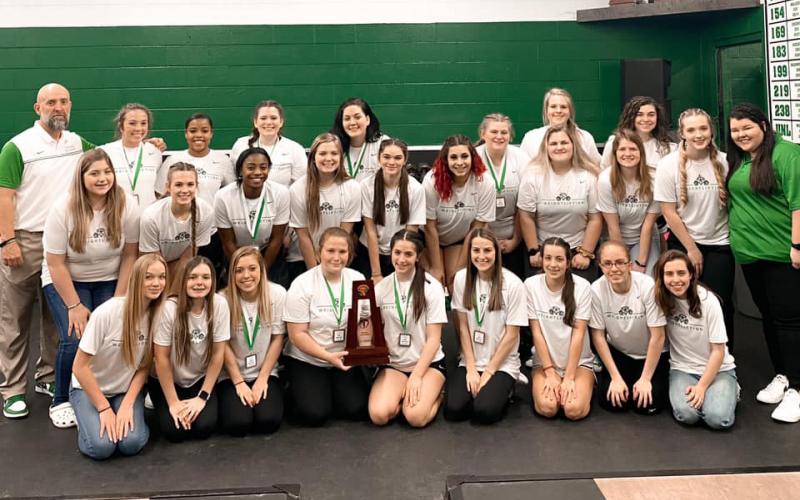 Suwannee’s girls weightlifting team poses with the Region 1-1A trophy on Friday. (COURTESY)