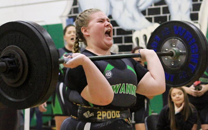 Suwannee lifter Autum Latreille performs the clean and jerk during Friday’s District 4-1A meet. Latreille was one of nine SHS lifters to win weight classes as the Lady Bulldogs won their third straight district title. (PAUL BUCHANAN/Special to the Reporter)