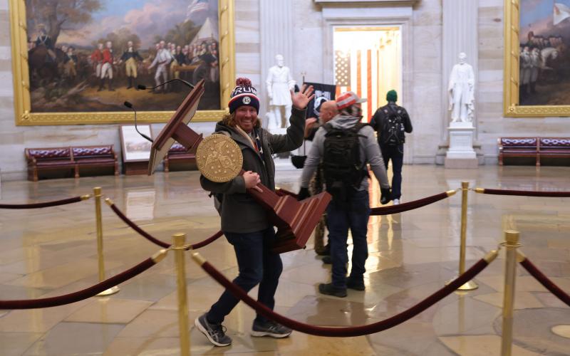 Adam Johnson, 36, of Parrish, faces felony charges after he was seen carrying House Speaker House Nancy Pelosi’s lectern through the U.S. Capitol on Jan. 6. (WIN McNAMEE/Getty Images/TNS)