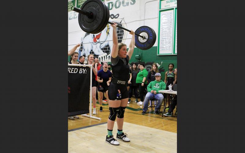 Branford’s Evie Pitts finishes her clean and jerk at the Region 1-1A meet. Pitts won first place in the 139 class. (PAUL BUCHNAN/Special to the Reporter)
