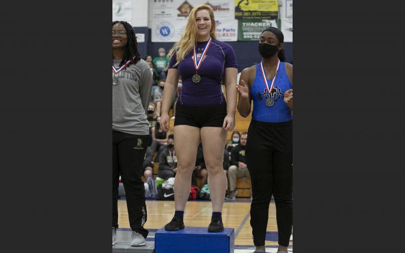 Columbia’s Reece Chasteen stands on the podium after winning first place in the 183 class at the Region 1-2A meet on Friday. (JEN CHASTEEN/Special to the Reporter)