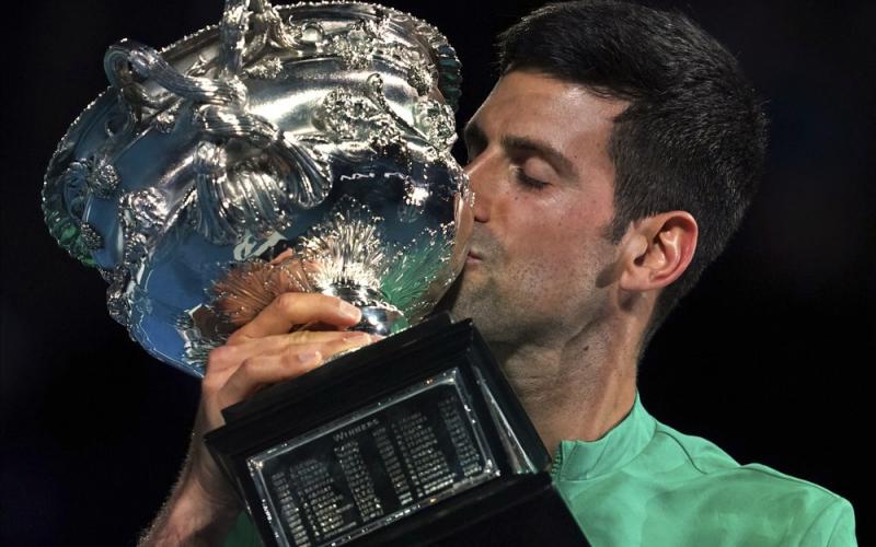 Novak Djokovic kisses the Norman Brookes Challenge Cup after defeating Daniil Medvedev in the men's singles final at the Australian Open on Sunday in Melbourne, Australia. (MARK DADSWELL/Associated Press)