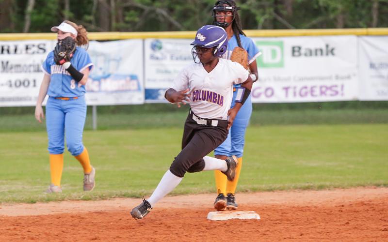 Columbia’s Zoryanna Hughes rounds second base to head towards third in a game against Chiefland last season. (FILE)
