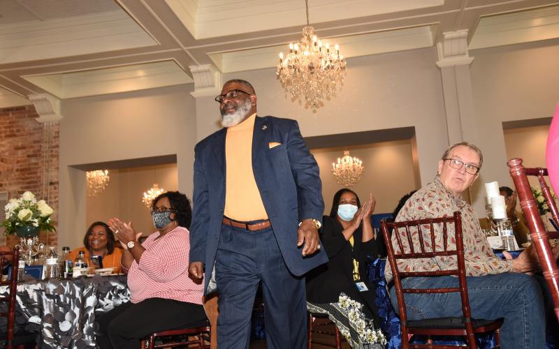 Carlos Brown is cheered as he prepares to accept his award as the Columbia County School District’s School-Related Employee of the Year at a luncheon at The Blanche last week. (COURTESY)