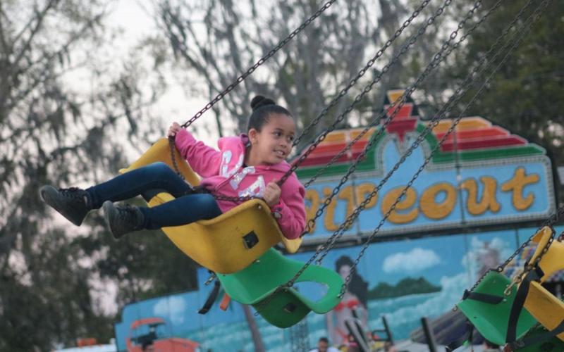 A child enjoys a swing on the midway at a previous year’s Suwannee County Fair. The fair has been canceled for the second straight year. (SUWANNEE DEMOCRAT PHOTO)