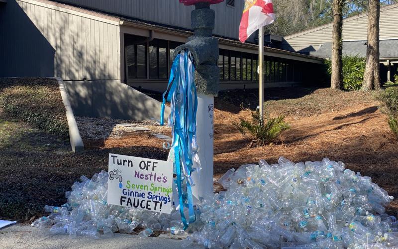 A demonstration set up by protesters Tuesday morning at the Suwannee River Water Management District headquarters against Seven Springs Company’s request for a permit renewal to withdraw nearly one million gallons a water a day from Ginnie Springs. (COURTESY)