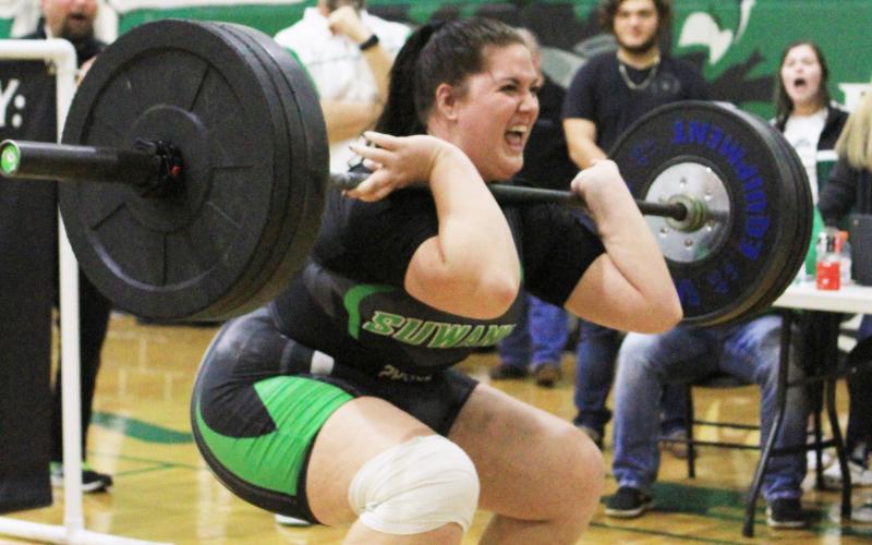 Suwannee’s Samantha Barber performs the clean and jerk during Friday’s Region 1-1A meet on Friday. Barber placed second in the unlimited class and received an at-large bid to state on Monday. (PAUL BUCHANAN/Special to the Reporter)