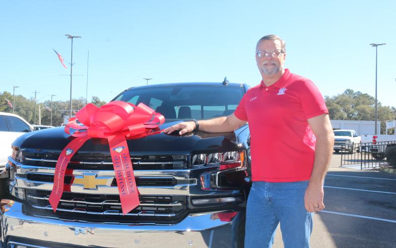 Don Meyer, a law enforcement officer and a concealed weapons instructor, won a 2021 Chevrolet Silverado in a registration contest from Legal Defense U.S. Law Shield. Meyer received the truck Wednesday at Rountree-Moore Chevrolet. (TONY BRITT/Lake City Reporter)